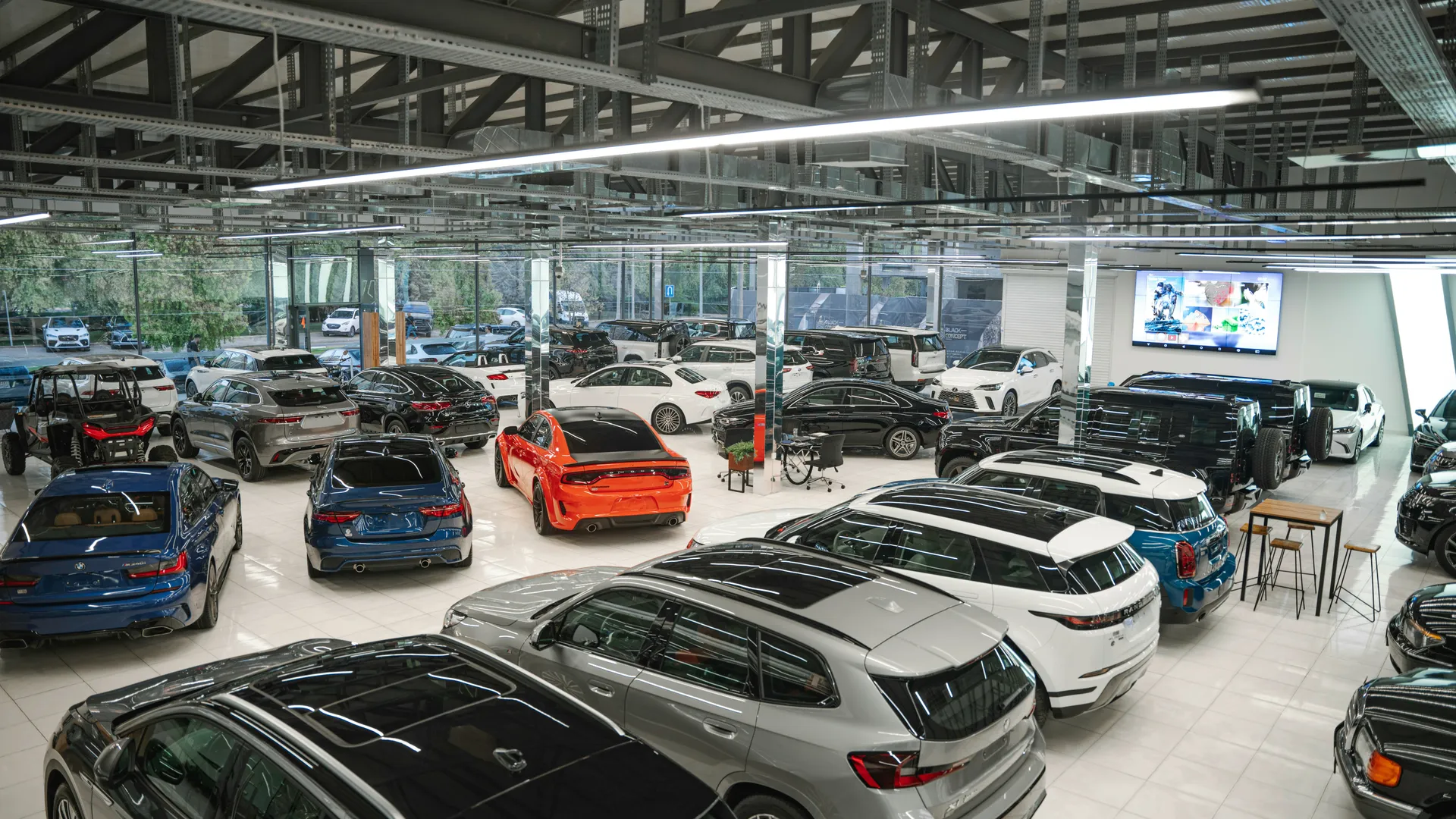 Modern car dealership showroom filled with vehicles